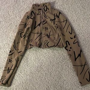 Brown crop top with black paint like design size xs
